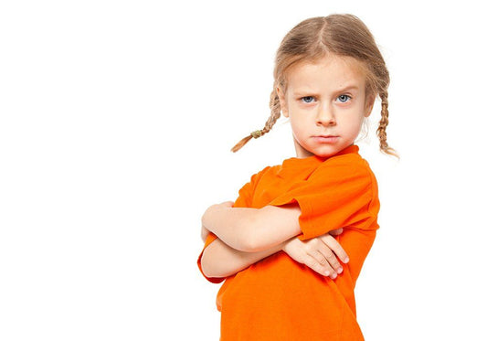 Child posing sassy with arms crossed