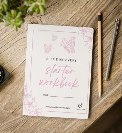 Self Discovery Starter Workbook on a wooden surface with a pen and pencil.